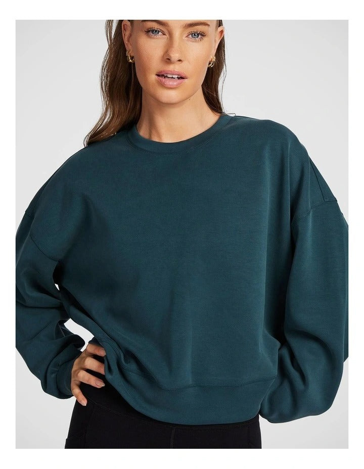 Rockwear Travel Hip Length Crew Sweater in Midnight Green, offering a cozy and relaxed fit for everyday comfort.