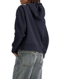 Champion Graphic Hoodie in Deep Navy – Classic pullover hoodie with bold logo print, premium fabric, and relaxed streetwear style.