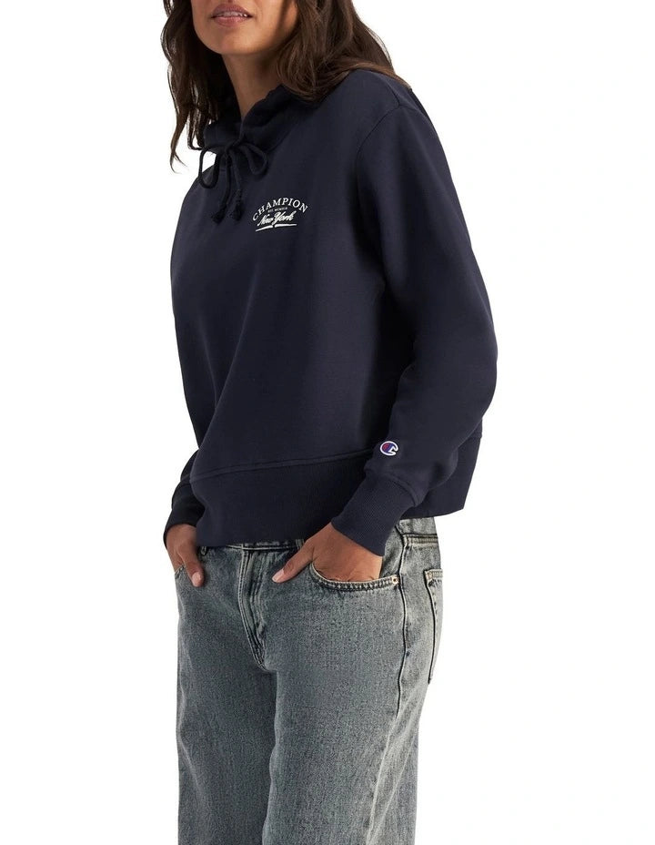 Champion Graphic Hoodie in Deep Navy – Classic pullover hoodie with bold logo print, premium fabric, and relaxed streetwear style.