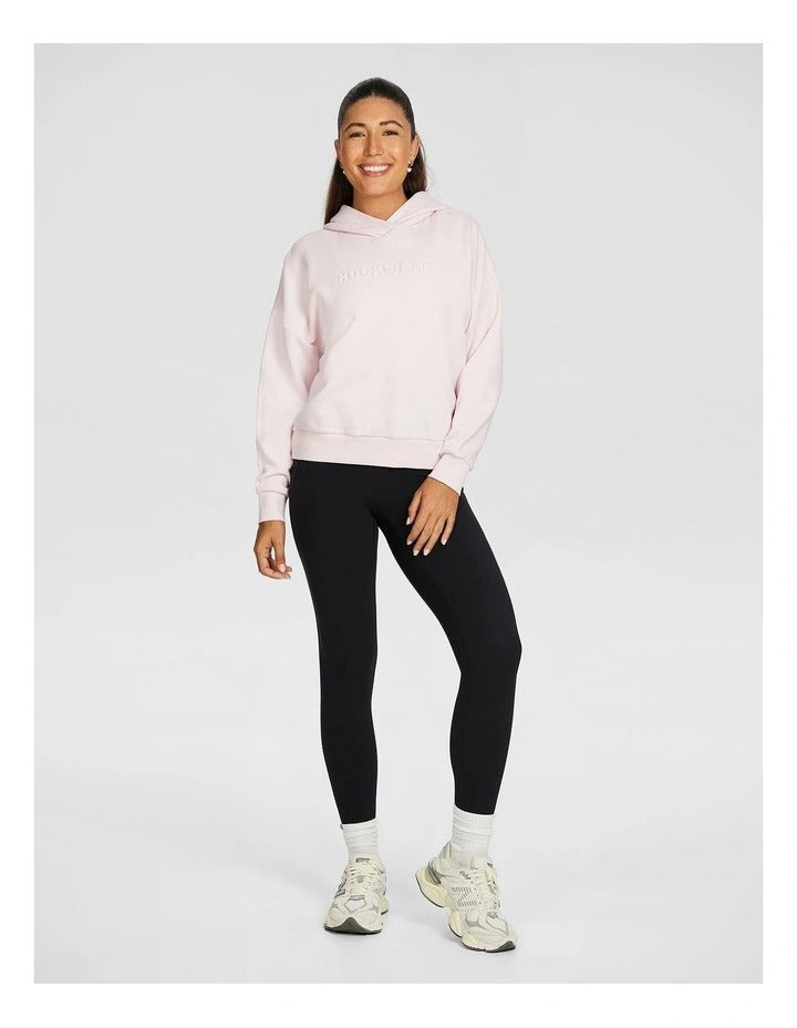 Rockwear Plush Fleece Hoodie in Pink Gin, women’s cozy fleece hoodie with relaxed fit, hip-length design, and soft fabric for comfort during workouts or casual wear.