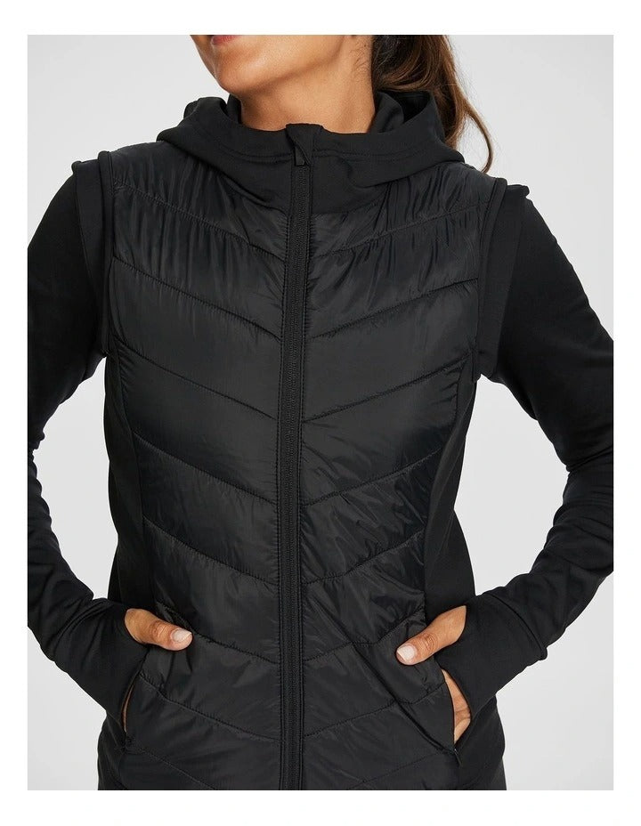 Rockwear Warm All Ways Vest in Black with cozy hood and chevron stitched panels.