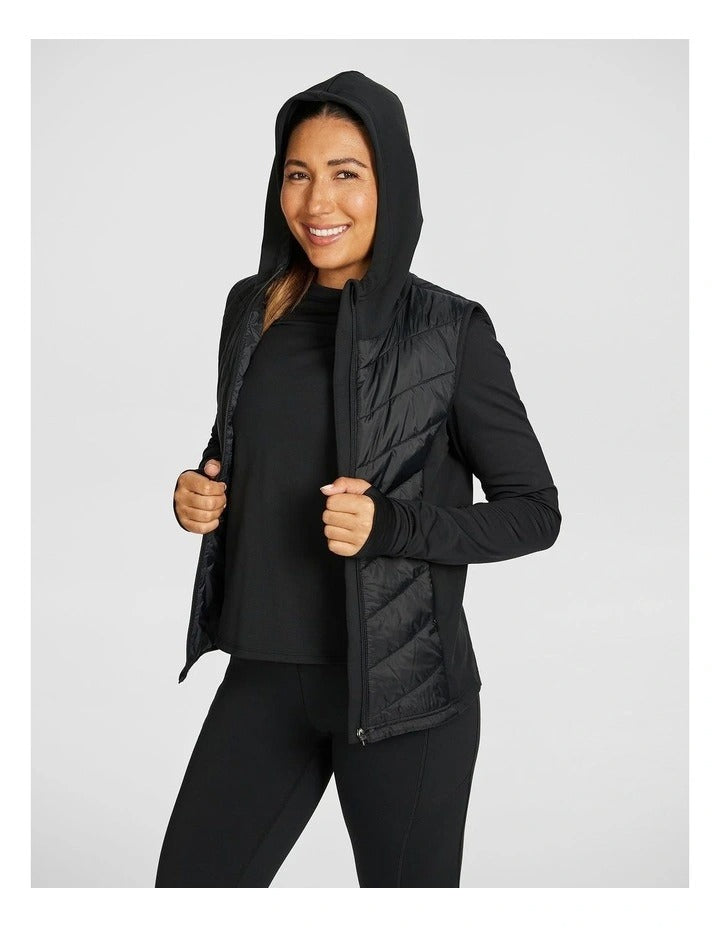 Rockwear Warm All Ways Vest in Black with cozy hood and chevron stitched panels.