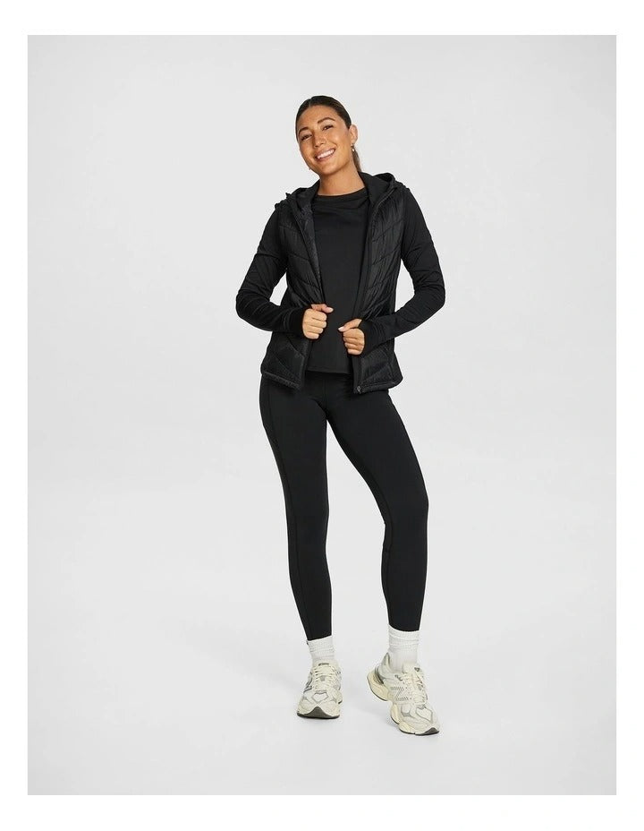 Rockwear Warm All Ways Vest in Black with cozy hood and chevron stitched panels.