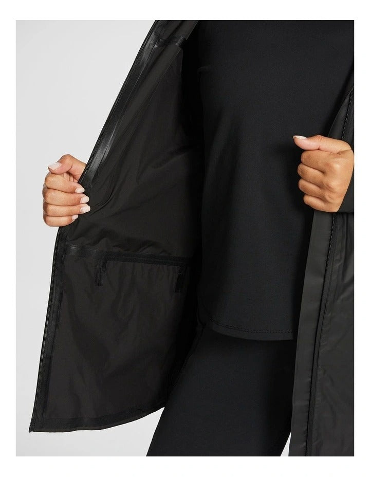 Rockwear Rain Jacket in Black, featuring a hood, Aquaguard zip, and snap close sleeve cuffs for weather protection.