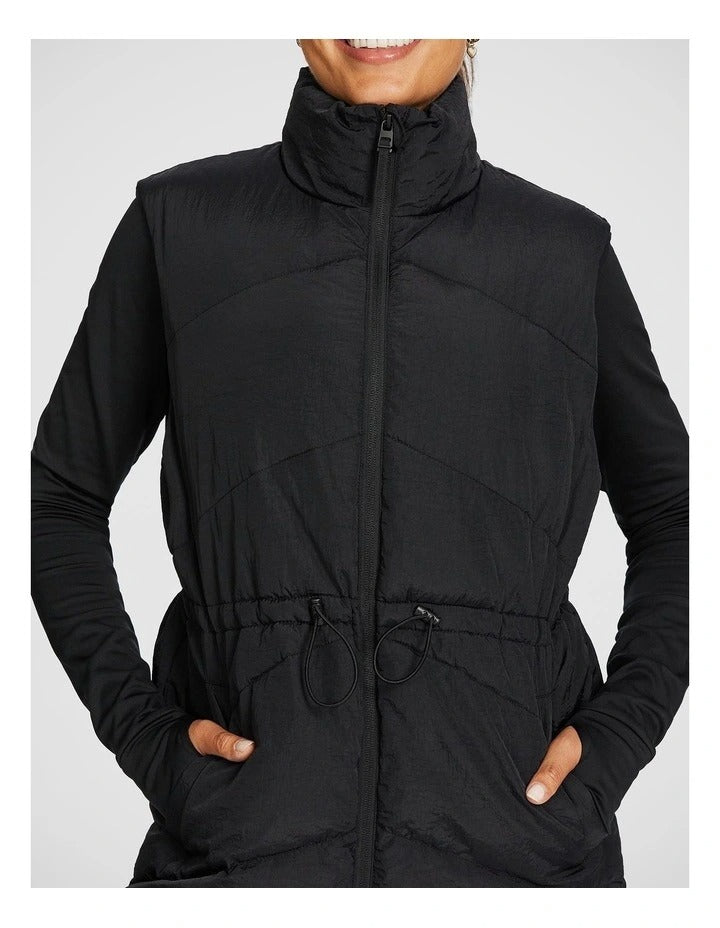 Black Longline Puffer Vest for Women by Rockwear – Adjustable Waist, Stand Collar, Full Zip, Side Phone Pockets