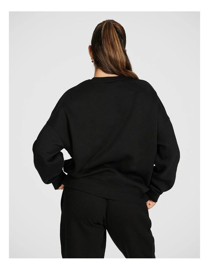 Rockwear Cosy Fleece Longline Crew Sweatshirt in Black offering full coverage and comfort.