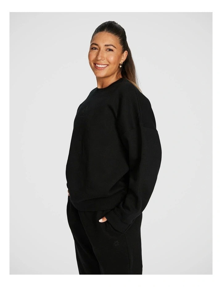 Rockwear Cosy Fleece Longline Crew Sweatshirt in Black offering full coverage and comfort.