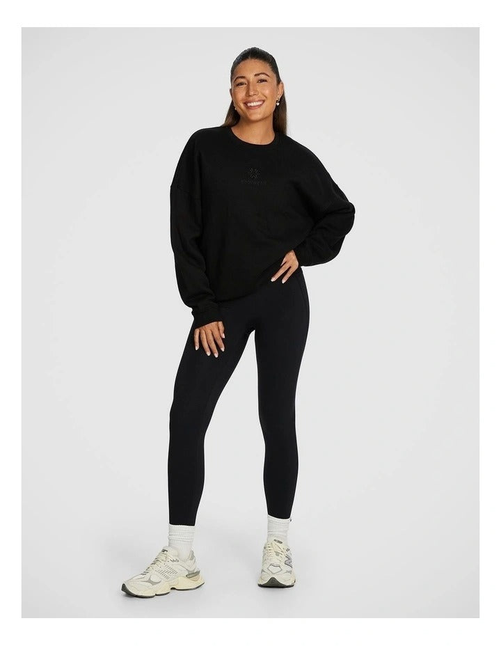 Rockwear Cosy Fleece Longline Crew Sweatshirt in Black offering full coverage and comfort.