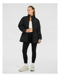 Rockwear Longline Puffer Jacket in Black, women's padded jacket with side phone pockets and a flattering cinched waist for warmth and style.