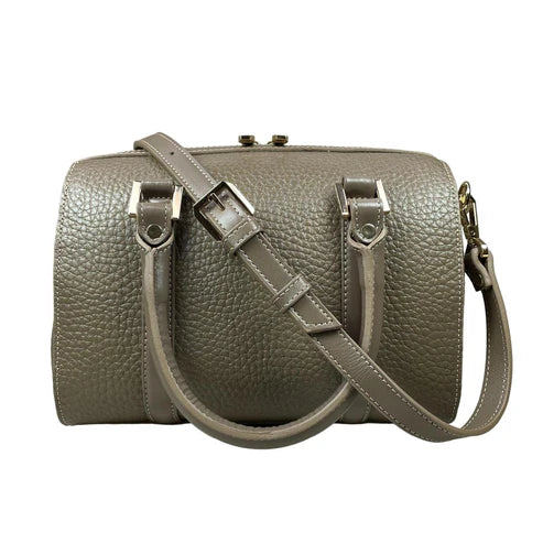 Beige genuine leather barrel shoulder bag with adjustable strap, minimalist design, and premium handcrafted finish.