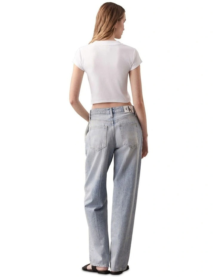 Calvin Klein Jeans white ribbed baby tee with short sleeves, crew neck, cropped fit, and Calvin Klein logo graphic on chest