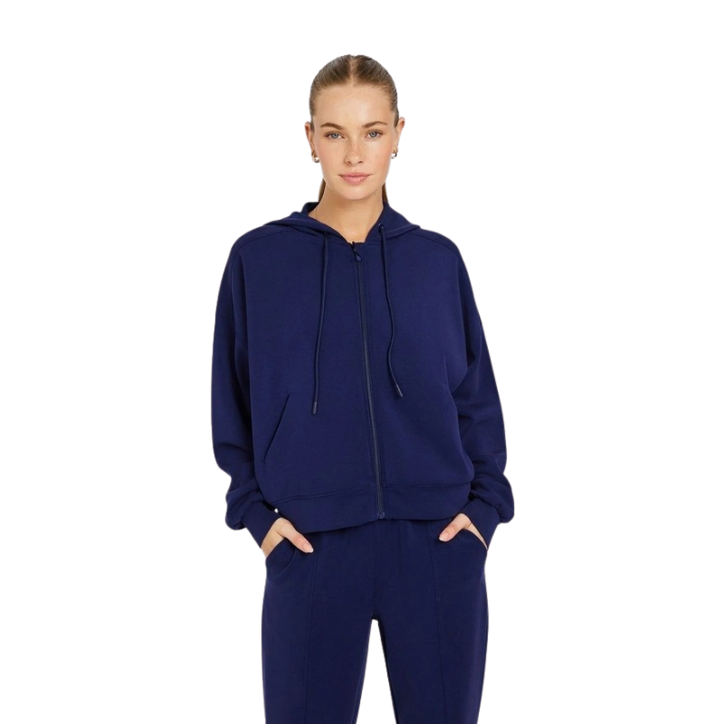 Rockwear Travel Zip Through Hoodie in Blue, featuring a relaxed fit, hip-length silhouette, and side pockets for a cozy, stylish look.
