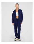 Rockwear Travel Zip Through Hoodie in Blue, featuring a relaxed fit, hip-length silhouette, and side pockets for a cozy, stylish look.