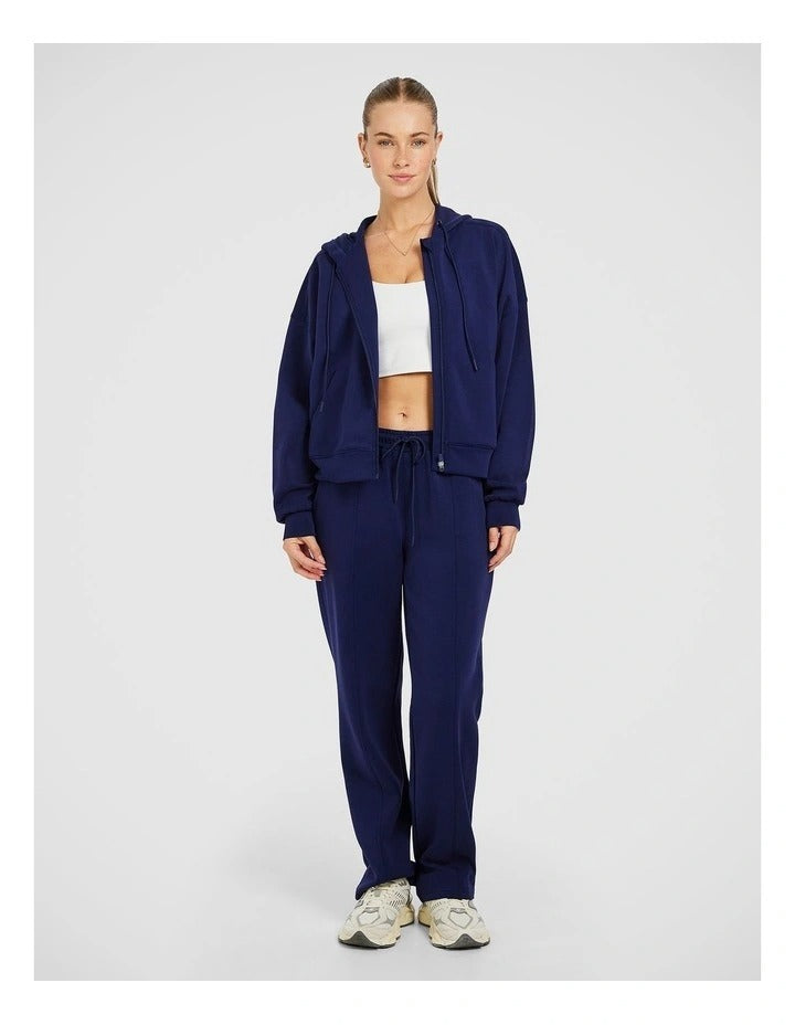 Rockwear Travel Zip Through Hoodie in Blue, featuring a relaxed fit, hip-length silhouette, and side pockets for a cozy, stylish look.