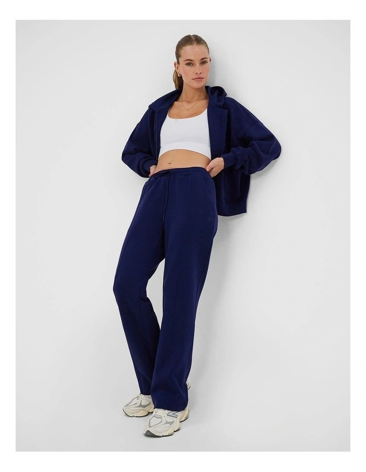 Rockwear Travel Zip Through Hoodie in Blue, featuring a relaxed fit, hip-length silhouette, and side pockets for a cozy, stylish look.
