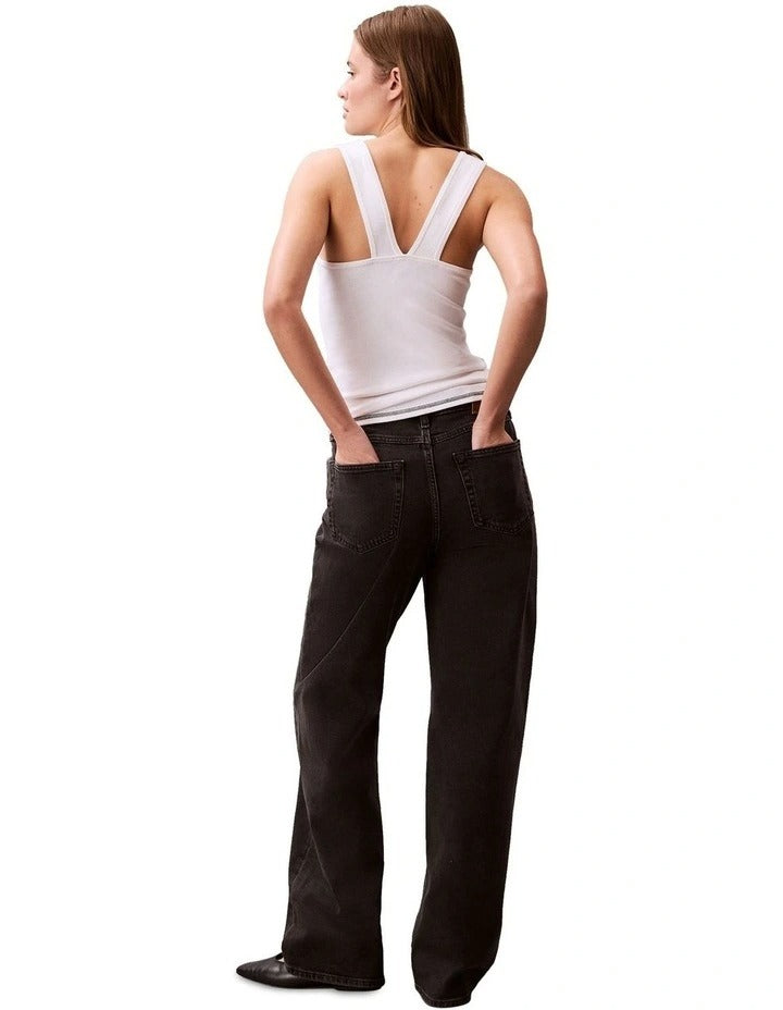 Calvin Klein Jeans white ribbed tank top with slim fit, scoop neck, sleeveless design and bold printed logo graphic at center
