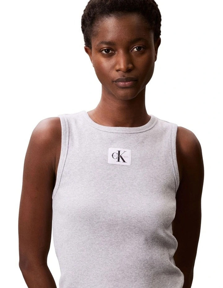 Calvin Klein Jeans grey ribbed cotton tank top with slim fit, scoop neckline, sleeveless design and woven monogram logo patch