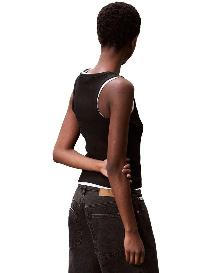 Calvin Klein Jeans black ribbed cotton tank top with slim fit, scoop neck, sleeveless design and woven monogram logo patch