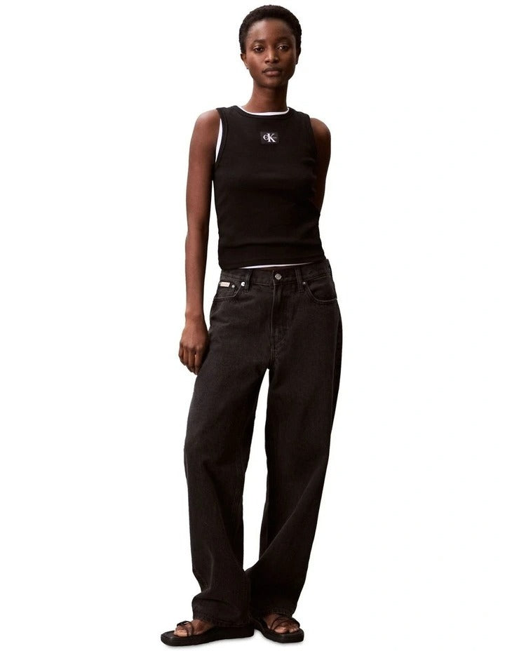 Calvin Klein Jeans black ribbed cotton tank top with slim fit, scoop neck, sleeveless design and woven monogram logo patch