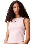 Calvin Klein Jeans pink ribbed cotton tank top with slim fit, scoop neck, sleeveless design, and woven monogram logo patch