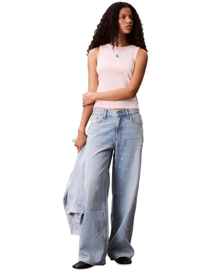 Calvin Klein Jeans pink ribbed cotton tank top with slim fit, scoop neck, sleeveless design, and woven monogram logo patch