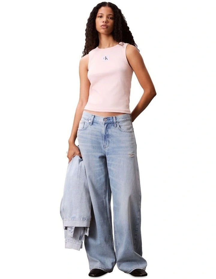 Calvin Klein Jeans pink ribbed cotton tank top with slim fit, scoop neck, sleeveless design, and woven monogram logo patch