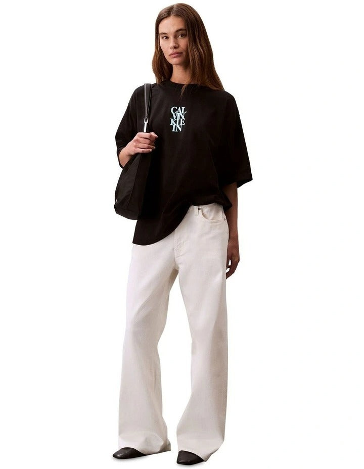 Calvin Klein Jeans oversized black t-shirt with bold logo graphic, boxy silhouette, crew neckline and short sleeves for women