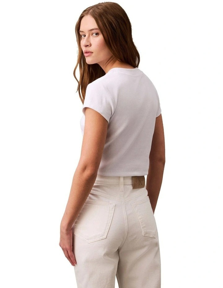 Calvin Klein Jeans white monogram baby tee with slim fit, cropped length, ribbed cotton stretch fabric, short sleeves and crew neck