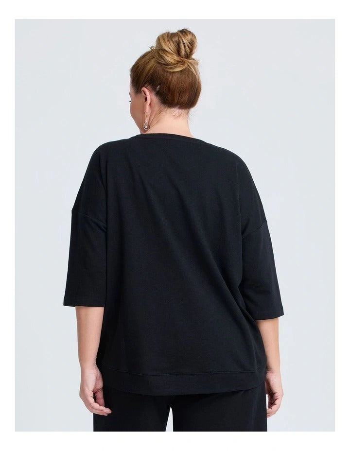 Taking Shape Patch Pocket Sweat in Black – plus size cotton-blend top with oversized front patch pockets, round neckline, and relaxed fit