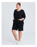 Taking Shape Patch Pocket Sweat in Black – plus size cotton-blend top with oversized front patch pockets, round neckline, and relaxed fit