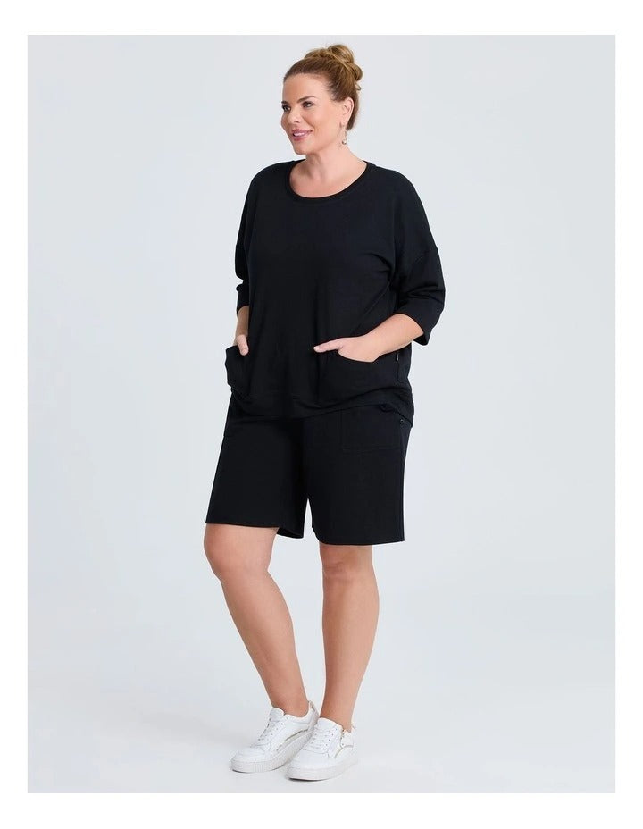 Taking Shape Patch Pocket Sweat in Black – plus size cotton-blend top with oversized front patch pockets, round neckline, and relaxed fit