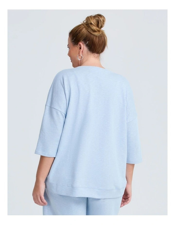 Taking Shape Patch Pocket Sweat in Ice Blue – plus size cotton-blend top with oversized front patch pockets, round neckline, and relaxed fit