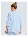 Taking Shape Patch Pocket Sweat in Ice Blue – plus size cotton-blend top with oversized front patch pockets, round neckline, and relaxed fit
