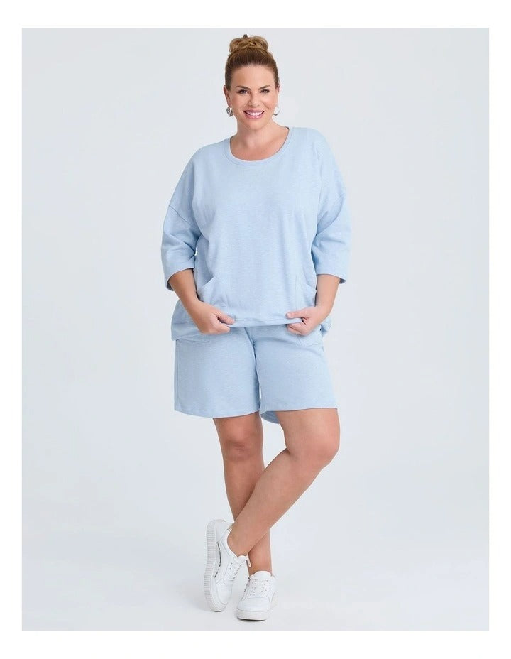 Taking Shape Patch Pocket Sweat in Ice Blue – plus size cotton-blend top with oversized front patch pockets, round neckline, and relaxed fit