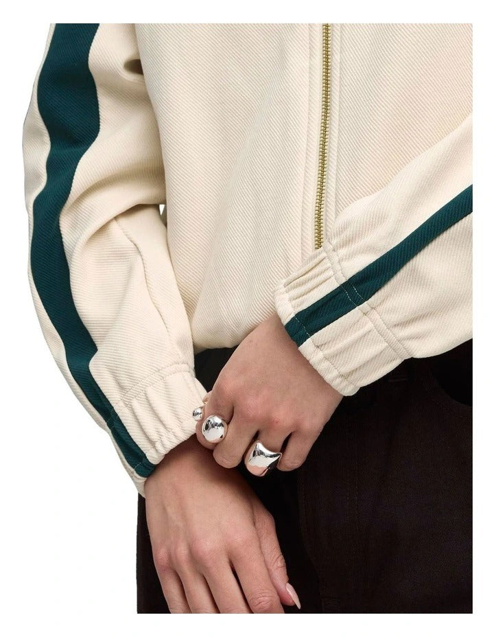 Puma T7 Relaxed Track Jacket with cotton polyester blend, full zip closure, shirt collar, welt zipper pockets, and embroidered Puma cat logo
