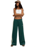 Puma T7 Low Rise Track Pants in black with 7cm signature stripes, elasticated waistband, zipper pockets, and Cat Logo embroidery