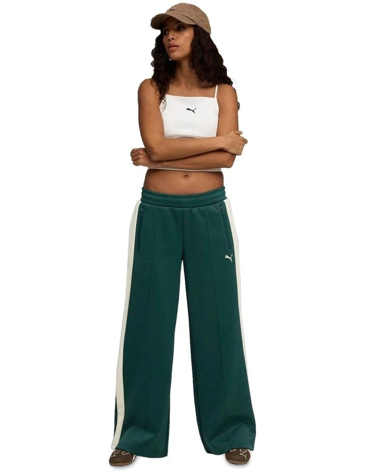 Puma T7 Low Rise Track Pants in black with 7cm signature stripes, elasticated waistband, zipper pockets, and Cat Logo embroidery