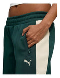 Puma T7 Low Rise Track Pants in black with 7cm signature stripes, elasticated waistband, zipper pockets, and Cat Logo embroidery