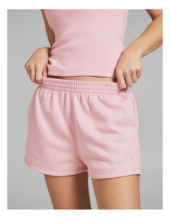 Rockwear women’s pink cosy fleece shorts with relaxed fit, side phone pockets, and regular rise, perfect for lounging or casual outings.