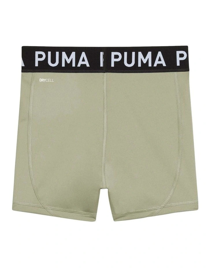 Green athletic shorts with a black Puma waistband on a white background
