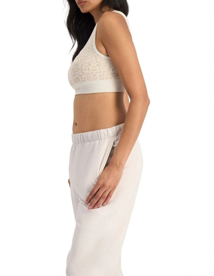 Move Rib Seamless Crop Bra with jacquard knit print, scoop neckline, removable cups and stretchy ribbed fabric for soft support