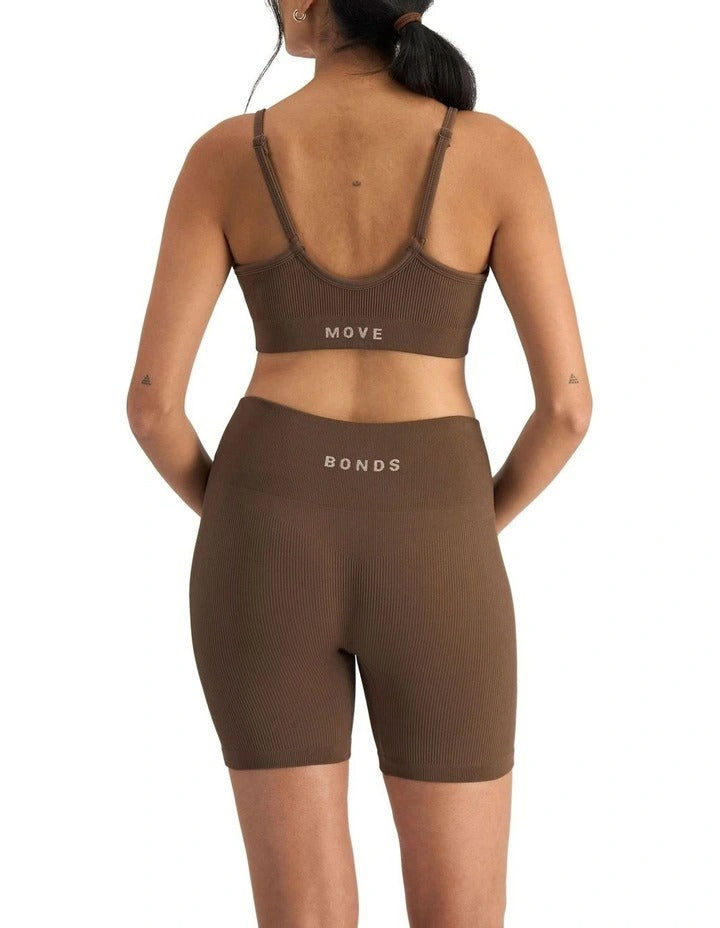 Move Rib Seamless Crop Bra in ribbed stretch fabric with removable cups, soft V-neckline, and supportive underbust elastic for low impact activities