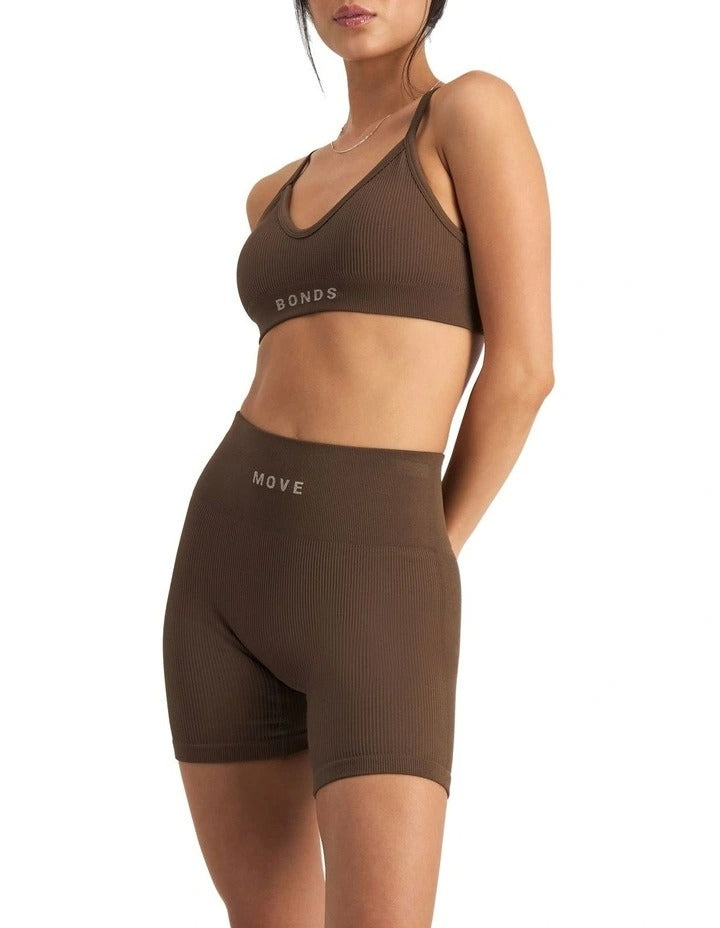 Move Rib Seamless Crop Bra in ribbed stretch fabric with removable cups, soft V-neckline, and supportive underbust elastic for low impact activities