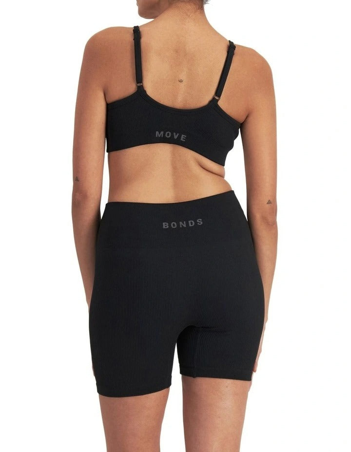 Move Rib Seamless Crop Bra with vee neckline, ribbed stretch fabric, removable cups, and underbust elastic for low impact support