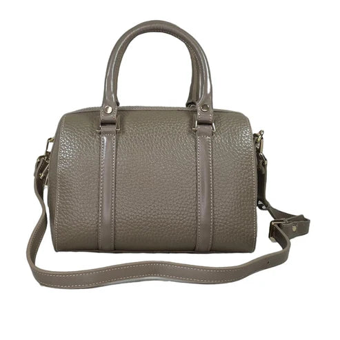 Beige genuine leather barrel shoulder bag with adjustable strap, minimalist design, and premium handcrafted finish.