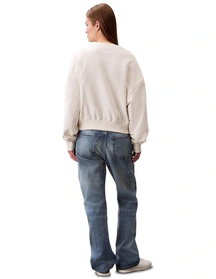 Calvin Klein women’s cotton terry crew neck sweatshirt with long sleeves, ribbed trims, and embroidered logo on chest