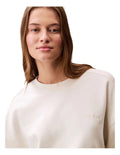 Calvin Klein women’s cotton terry crew neck sweatshirt with long sleeves, ribbed trims, and embroidered logo on chest