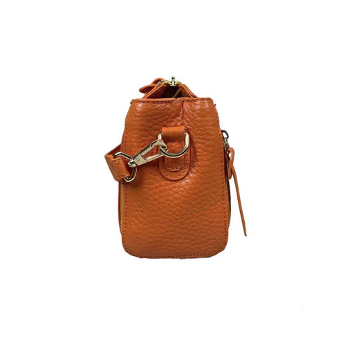Stylish orange leather handbag for girls by LeatherLuxe – premium shoulder bag with elegant design and fine craftsmanship.