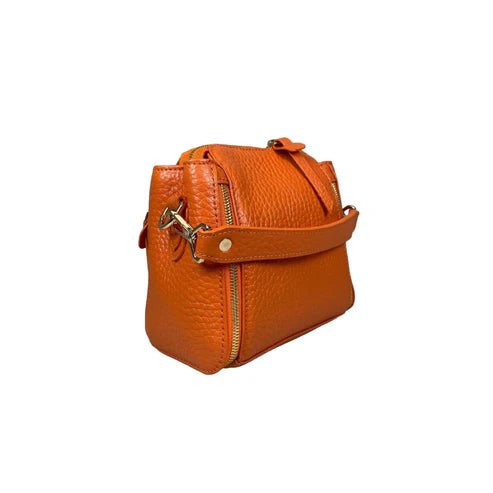 Stylish orange leather handbag for girls by LeatherLuxe – premium shoulder bag with elegant design and fine craftsmanship.