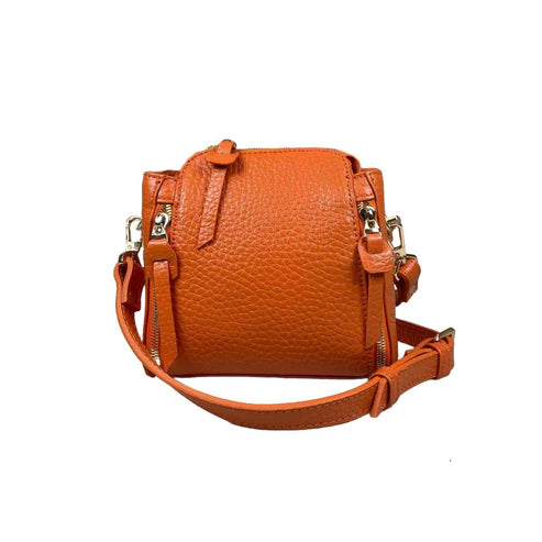 Stylish orange leather handbag for girls by LeatherLuxe – premium shoulder bag with elegant design and fine craftsmanship.